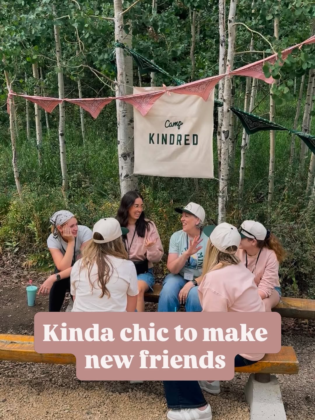 Camp Kindred friends sitting together outdoors among the trees