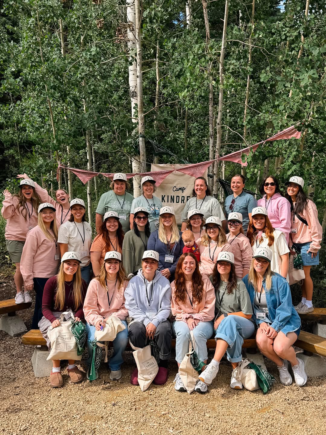 Camp Kindred campers gathered together in an aspen grove